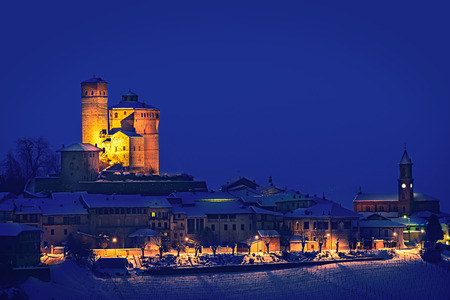 Serralunga castle during a cold winter night with snow in langhe region, Italyのeditorial素材