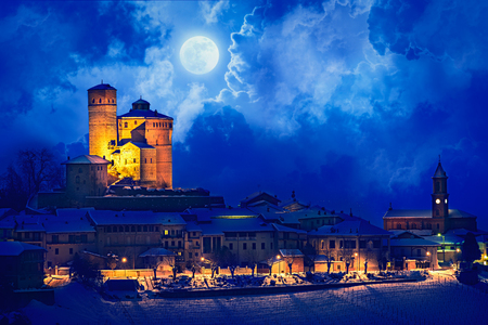 Serralunga castle during a cold winter night with snow in langhe region, Italyのeditorial素材