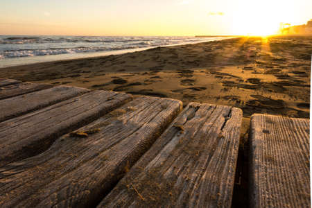 detail of a jetty on the sea during sunsetの写真素材