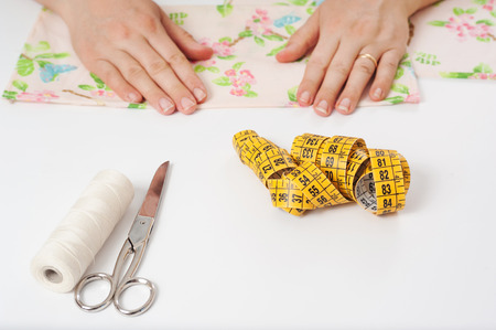 hands of young woman sewingの写真素材