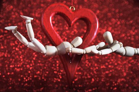 mannequins in love, playing with a wooden heart