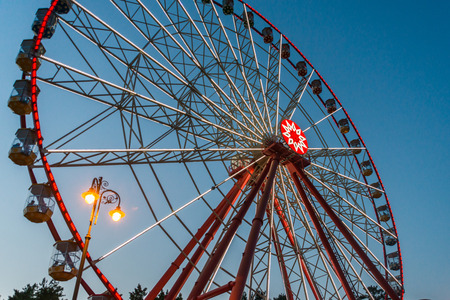 Nice Ferris wheel in late evening with beautiful lights in a parkのeditorial素材