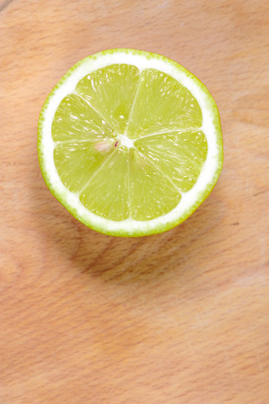 Half fresh lemon on wood backgroundの写真素材