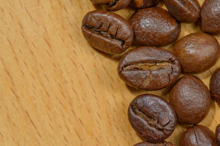 Macro of several toasted coffee seeds