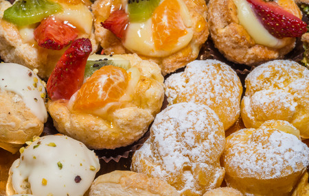 colorful fruits pastries with cream and chocolate the real Italian confectioneryの写真素材