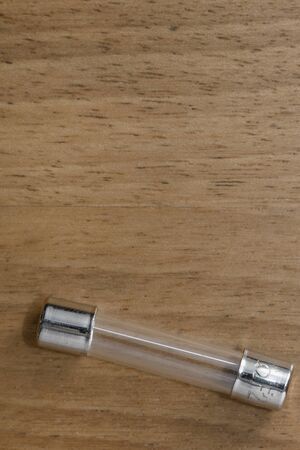 A fuse on a wood tableの写真素材