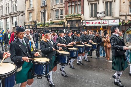 London, UK - March 13, 2011: People watching drummers in Saint Patrick parade in trafalgar londonのeditorial素材
