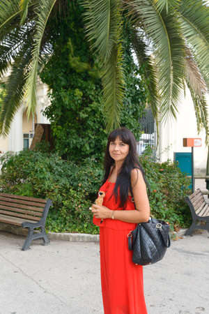 nice girl in red posing and smilingの写真素材