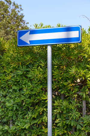 Signpostin on the highway, go left, one wayの写真素材