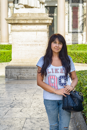 nice girl posing in the cloister of saint Paolo (Paul) church in Rome Italyの写真素材