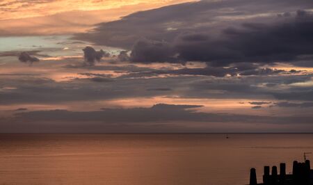 awesome sunset at seaside near Rome in Italyの写真素材