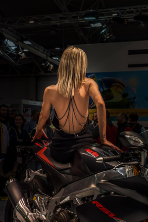 Rome, Italy - March 08, 2014: Model girl posing sexy on a motorcycle, motorshow 2014 in Romeのeditorial素材