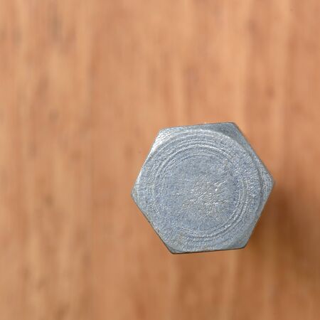 One bolt on wood blur backgroundの写真素材
