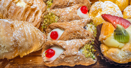 colorful pastries with fruits, cream and chocolate, the real Italian confectioneryの写真素材