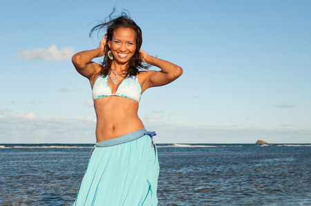 Beautiful and sexy girl posing and smiling at the beach in dominican republicの写真素材