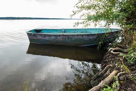 An old boat along the Kharkiv River, Ukraineの写真素材