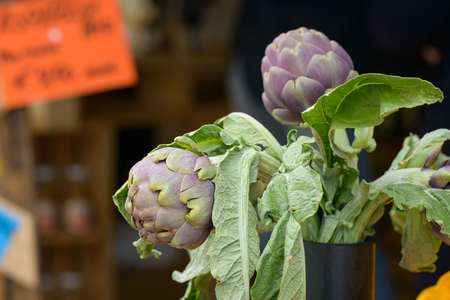 Artichokes for sale at the market in a village festival, artichoke is'a typical food of Romeの写真素材