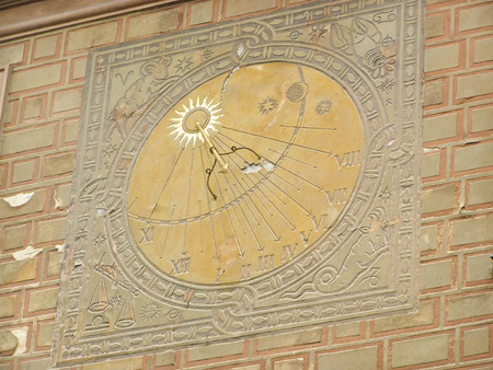 Nice gold sundial on a wall in Krakow