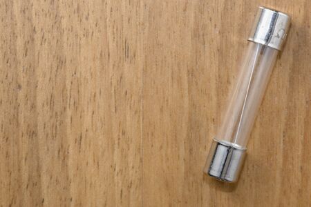 A fuse on a wood tableの写真素材