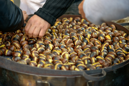 roasted chestnuts sold in the street in rome italyの写真素材