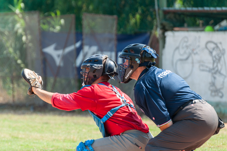 Rome, Italy - July 11, 2010: A catcher and the referee during an inning of a game in a local cupのeditorial素材