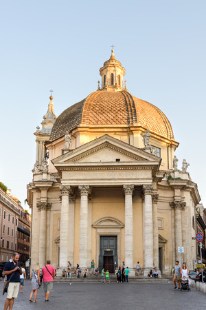 Rome, Italy - August 22, 2015: people walking in Popolo square in Rome, the church in backgroundのeditorial素材
