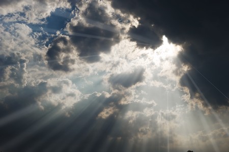 Sunbeams coming through the coudsの写真素材