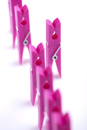 Clothespins in a row. Concept: standing out from the crowdの写真素材