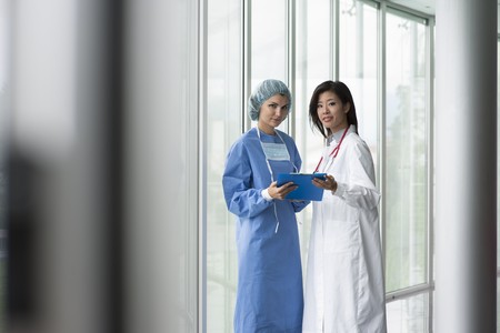 Female doctor and surgeon consultingの写真素材