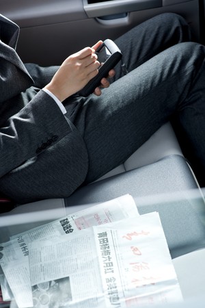Young chinese business woman inside a carの写真素材