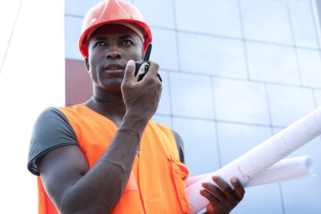 Construction worker speaking on Walkie-Talkie