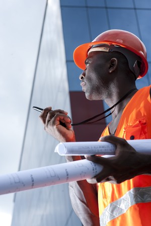 Construction worker speaking on Walkie-Talkie