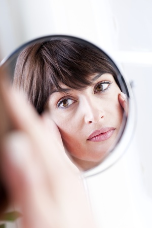 Woman Looking At Herself In The Mirrorの写真素材