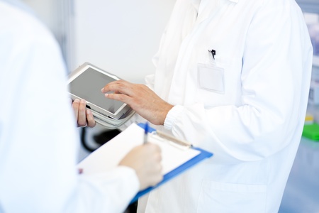 Young researcher using tablet PCの写真素材