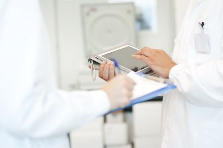 Young researcher using tablet PC