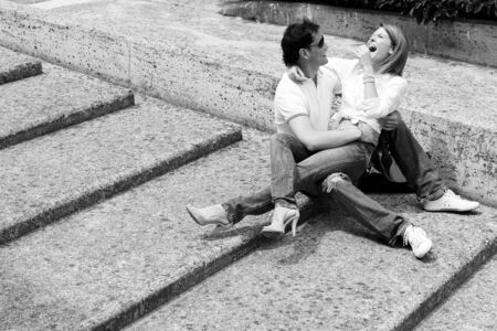 Beautiful and happy young couple in love having fun togetherの写真素材