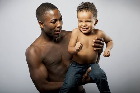 Father and son, child making facial expressionの写真素材