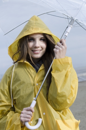 Young woman enjoying a rainy dayの写真素材