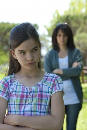 Little girl being told off by her motherの写真素材