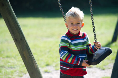 Little boy wiht swingの写真素材