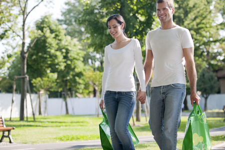 Young couple with reusable bagsの写真素材