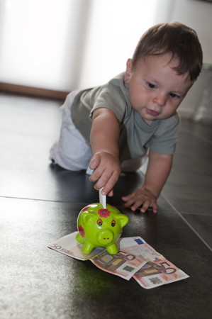 8-months baby saving moneyの写真素材