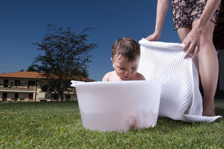 Baby enjoying his bath outodors