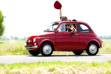 Senior happy couple driving vintage carのeditorial素材