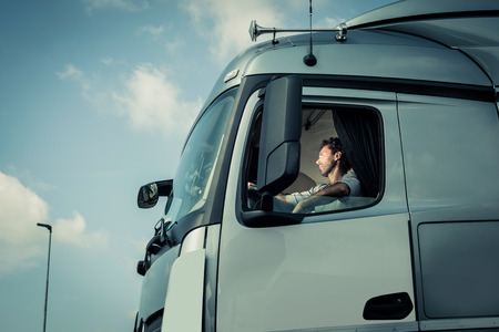 Portrait of a truck driver sitting in cabの写真素材