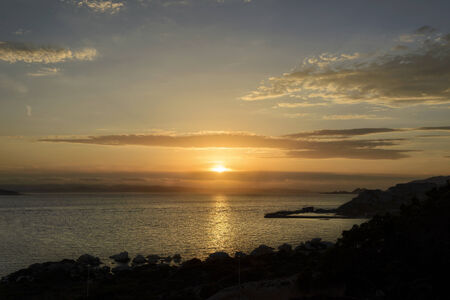 Sunset sea reflection clouds coastの写真素材