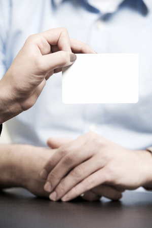 blank white ticket presented by a handの写真素材