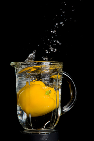 Gazpacho ingredient, yellow pepper with water splashの写真素材