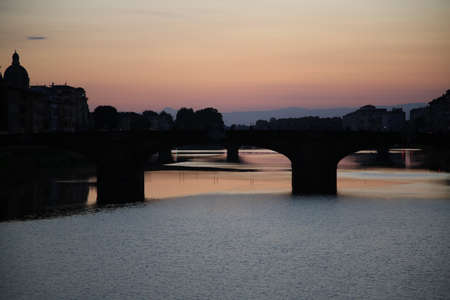 Sunset on the Arno river in Florenceの写真素材
