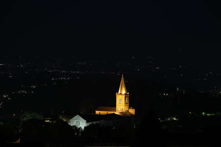 The bell tower of Santa Giuliana in Perugia at nightの写真素材
